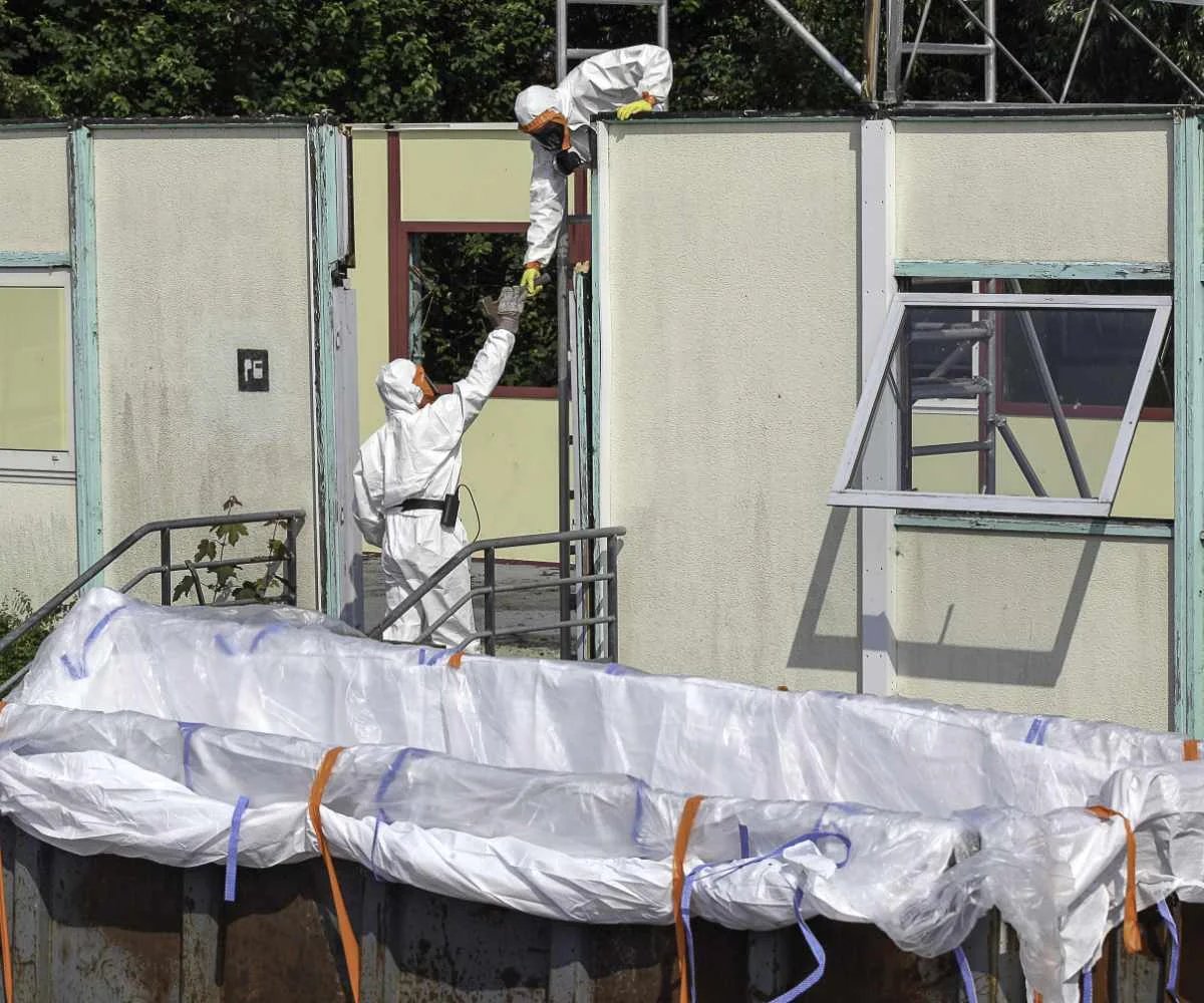 Asbestos removal Workers on an asbestos removal site